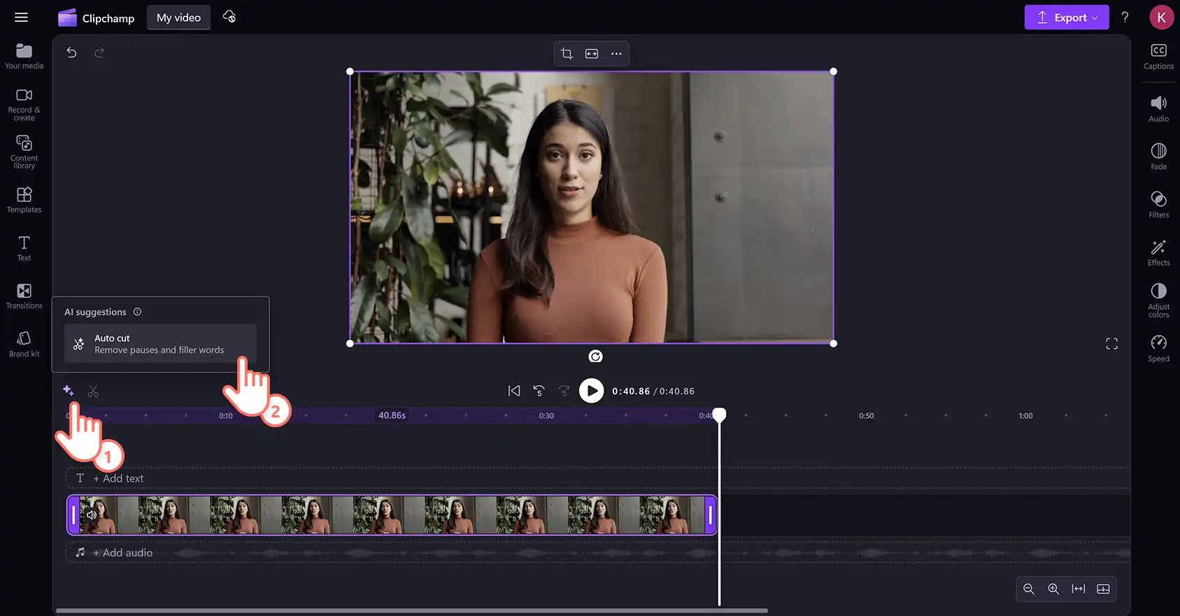 2048-41 Clipchamp video düzenleyicide parıltı simgesine ve otomatik kesme düğmesine tıklayan bir kullanıcı.